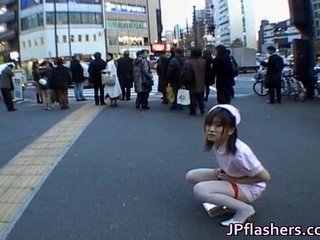 Naughty Asian girl is pissing in public